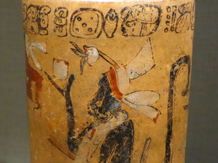 A painted Maya vase showing monkeys beside a cacao tree