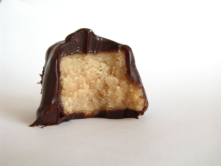 A cake covered with a glossy chocolate ganache