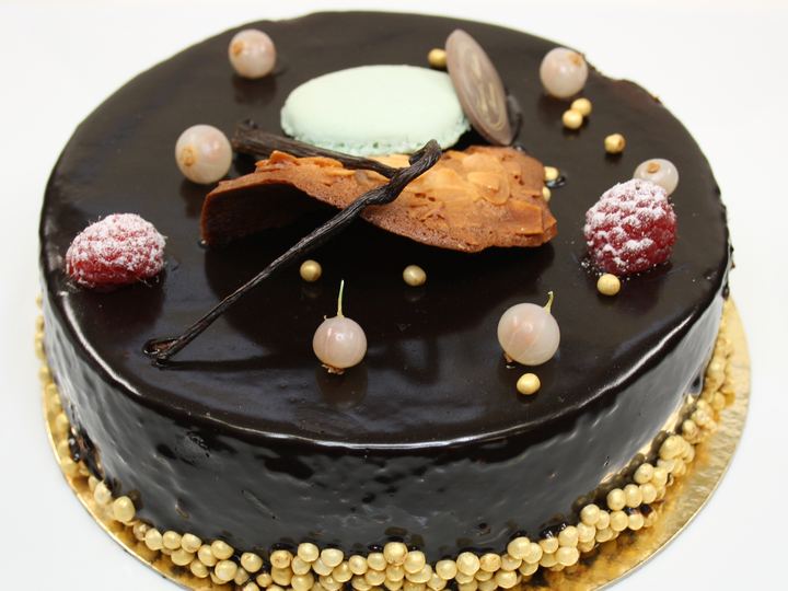 A slice of dark chocolate mousse cake on a plate