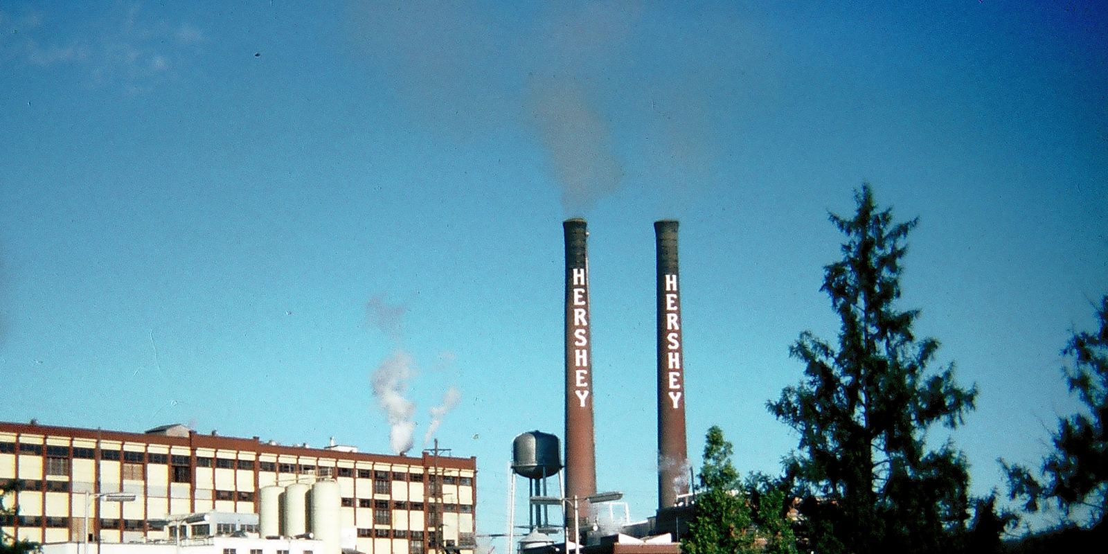 The historic Hershey chocolate factory buildings with tall smokestacks
