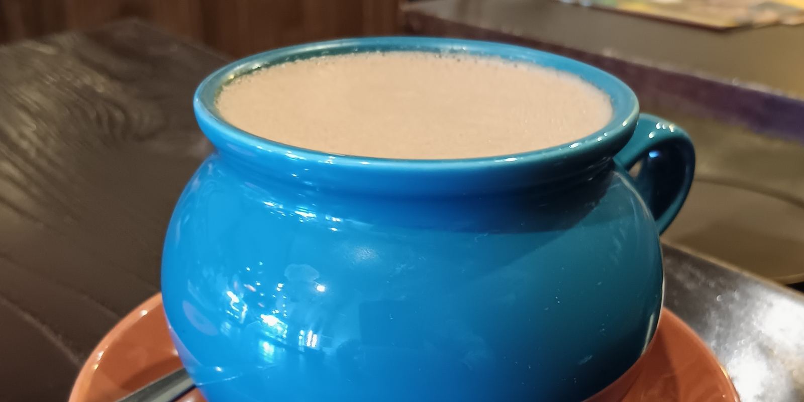 A cup of dark hot chocolate viewed from above